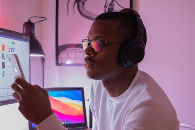 A photo of someone holding a phone while working